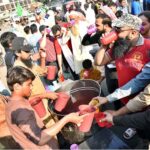 People are drinking thirst-quenching water drinks outside the press club to reduce the intensity of the heat