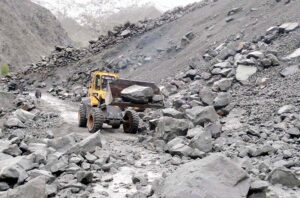 Workers of Gilgit-Baltistan Disaster Management Authority and GBPWD busy in clearing blocked road of Astore after heavy rain and land sliding in the area.