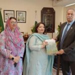 IUCN country representative Mahmood Akhtar Cheema presenting an annual monitoring and evaluation report on UGPP & forestry to the PM's Coordinator on climate change Romina Khurshid Alam.