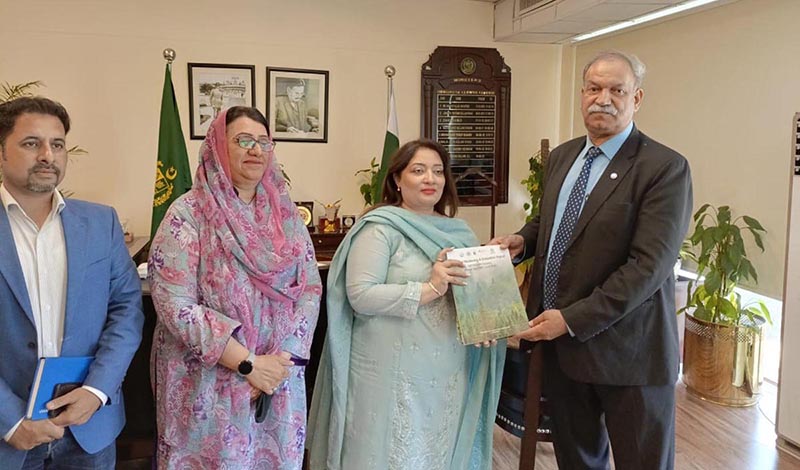 IUCN country representative Mahmood Akhtar Cheema presenting an annual monitoring and evaluation report on UGPP & forestry to the PM's Coordinator on climate change Romina Khurshid Alam.