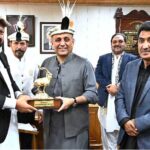 Chief Minister Gilgit-Baltistan Haji Gulbar Khan presenting shield to Federal Minister for Communication Abdul Aleem Khan at CM Secretariat