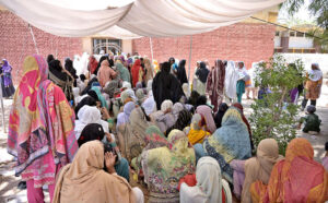 Female are waiting for their turn to get money from cash counter under Benzair Income Support Program at Government Comprehensive Girls High School.