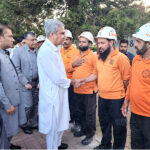 Federal Minister for Interior Mohsin Naqvi shaking hands with the personnel of Emergency Services at CDA Headquarters