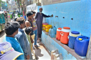 People busy in filling their pots with drinking water from water filtration plant at Phulile area.