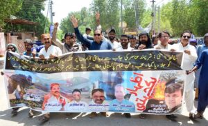 Workers of Pakistan Minority Itehad participating in a rally to express solidarity with Pak Army at Post Office Road.