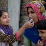 A daughter tenderly feeding cake to her mother and pays tribute to her on Mother's Day, honoring the love and sacrifices that define their cherished bond