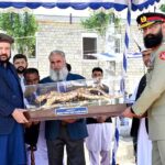 Chief Minister Gilgit-Baltistan Haji Gulbar Khan giving away trophy to the position holder cadets during the 19th passing out parade of Cadet College Skardu