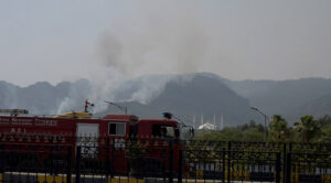 A view of smoke emitting after fire erupts at Margalla Hills in the Federal Capital.
