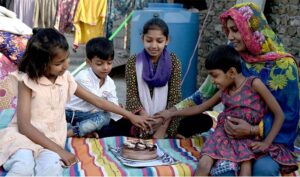 A daughter tenderly feeding cake to her mother and pays tribute to her on Mother's Day, honoring the love and sacrifices that define their cherished bond