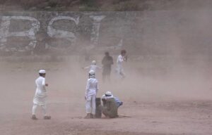 Children playing in a ground as strong duststorm obstruct them at Barakahu.