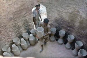 Labourers busy in plaster roadside protective wall as the world celebrates International Labour Day. May 1st, International Workers’ Day, commemorates the historic struggle of working people throughout the world. In 1884, the Federation of Organized Trades and Labour Unions passed a resolution stating that eight hours would constitute a legal day’s work from and after May 1, 1886.