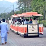 People enjoy tram ride at Lake View Park in the Federal Capital