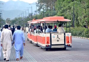 People enjoy tram ride at Lake View Park in the Federal Capital