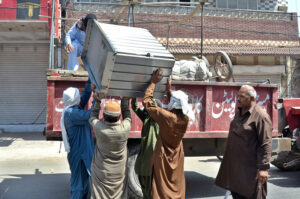 Staffers of Anti-Encroachment Cell removing encroachment from Masoom Shah Road.