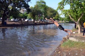 Youngster jumping into the canal to get relief from hot and humid weather in the Provincial Capital.