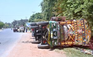 A truck lies overturned after accident at Chak Shahzad Road in the Federal Capital
