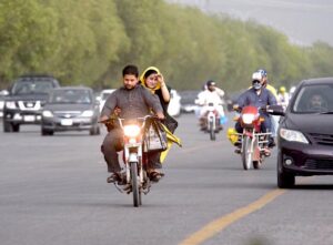 Children playing in a ground as strong duststorm obstruct them at Barakahu.