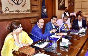 A group photograph of Secretary Labor and Human Resources Punjab Naeem Ghous along with, SVP SCCI Wahab Jahangir and others at Chamber of Commerce and Industry.