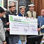 Chief Minister Gilgit-Baltistan, Haji Gulbar Khan giving away cheque of Entry Fees community share of the Khunjrab National Park to the community representative.