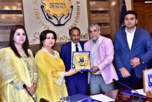 A group photograph of Secretary Labor and Human Resources Punjab Naeem Ghous along with, SVP SCCI Wahab Jahangir and others at Chamber of Commerce and Industry.