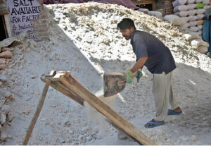 Labourer busy in sift pink salt at his workplace in Provincial Capital.