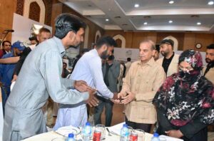 Prime Minister Muhammad Shehbaz Sharif greets a labourer at a luncheon he hosted in their honour on the occasion of Labour Day.