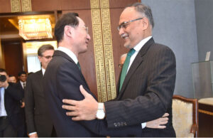 Federal Minister for Planning, Development and Special Initiative Prof. Ahsan Iqbal presenting commemorative coin and postage stamp which launched to celebrate the "Decade of CPEC" to Vice Foreign Minister of China H.E. Sun Weidong at Ministry of Foreign Affairs, Beijing.