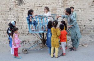 Kids delight in the joy of swing at roadside in the Provincial Capital.