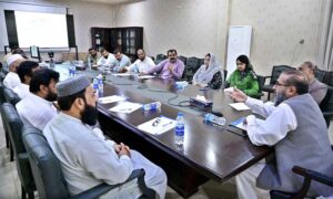 Chief Commissioner FBR Sargodha Region Dr. Faheem Mohammad is addressing meeting with stone crusher market officials.