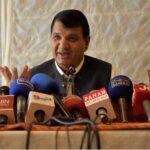 Muqam pays glowing tributes to martyred AC, lays flowers wreath on his grave
