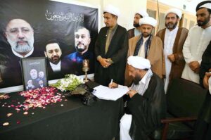 Ulemas (religious scholars) pen messages in a condolence book placed at Khana-e-Farhang Iran following the death of Iranian President Ebrahim Raisi and other officials in a helicopter crash.