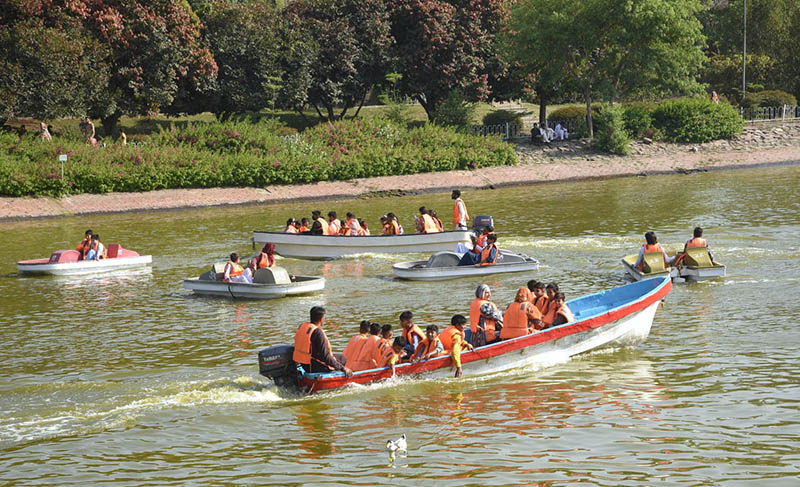 People are enjoy boating at Gulshan e Iqbal Park