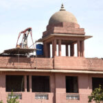 Laborer busy the repair work of Punjab University at Old Campus.