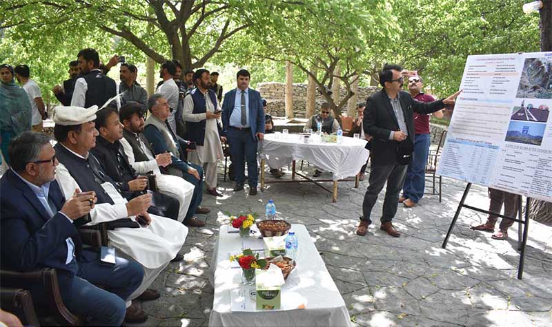 Federal Minister for Kashmir Affiars and Gilgit-Baltistan Engineer Amir Muqam being berifed by Project Director about the 54 Maga Wat hydro power project at Attaabad Lake Hunza