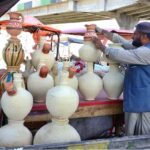 A vendor displaying Matkas at road side in Quetta as it’s common in summer to keep water cold.