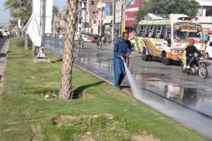 PHA staffer busy washing Kashmir Road.