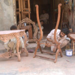 Carpenters making wooden furniture at their workplace