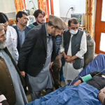 Chief Minister Gilgit-Baltistan Haji Gulbar Khan inquiring about the health of injured persons at PHQ as a passenger bus faced an accident near Chilas in a result 22 died and other injured.