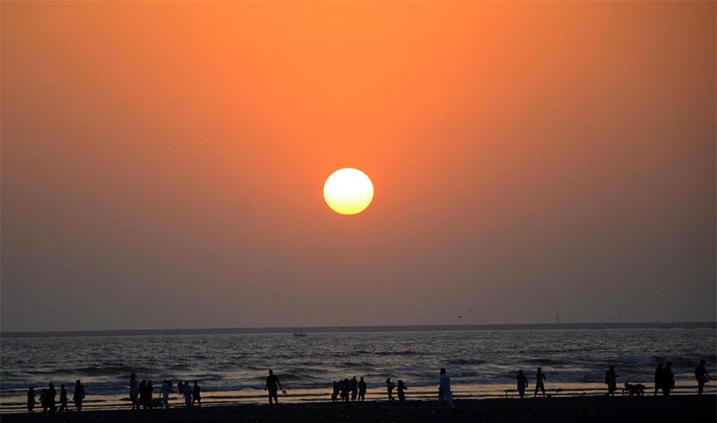 An attractive view of sunset during people visiting sea view Beach in the Provincial Capital.