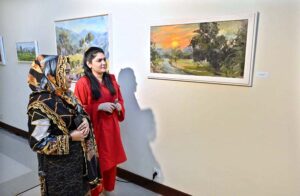 Visitors viewing paintings during exhibition "Impression of Pakistan" by Gonzelo Ruiz Navarro organized by Pakistan National Council of the Arts and the Embassy of Spain at PNCA.