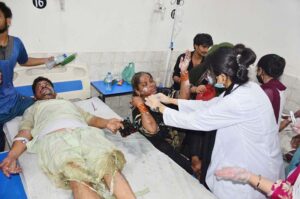 Doctors giving treatment to people at Civil Hospital who sustain burn injuries after cylinder explosion at Peratabad.