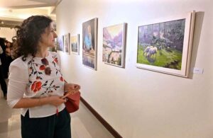 Visitors viewing paintings during exhibition "Impression of Pakistan" by Gonzelo Ruiz Navarro organized by Pakistan National Council of the Arts and the Embassy of Spain at PNCA.
