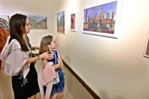 Visitors viewing paintings during exhibition "Impression of Pakistan" by Gonzelo Ruiz Navarro organized by Pakistan National Council of the Arts and the Embassy of Spain at PNCA.