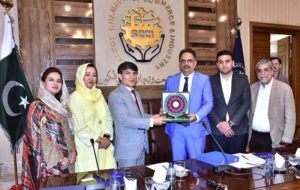Chamber of Commerce President, Abdul Ghafoor Malik presenting a shield to Additional Secretary Ministry of Foreign Affairs Muhammad Salim Bhatti during foreign diplomats delegation visit SCCI.
