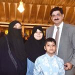 Sindh Chief Minister Syed Murad Ali Shah poses for a photo with the family members of Shuhdas at Paigham-e-Aman - 9th May organised by the Sindh Information dept