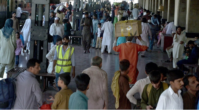 People arriving at Railway station depart their hometowns to spend Eid ul Azha holidays with their loved ones