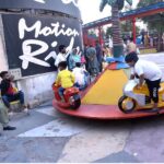 Children enjoy motion ride while celebrating the last day of Eid ul Azha holidays in Allama Iqbal Park, Murree Road