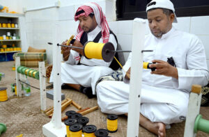MAKKAH AL-MUKARRAMAH: June 14 – Artisans decorate Kiswah, the covering of the Holy Kaaba, with verses from the Holy Quran embroidered onto the it, at a Kiswah manufacturing factory.