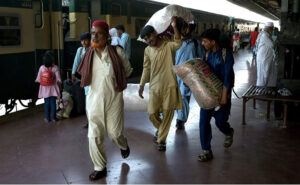 People arriving at Railway station depart their hometowns to spend Eid ul Azha holidays with their loved ones