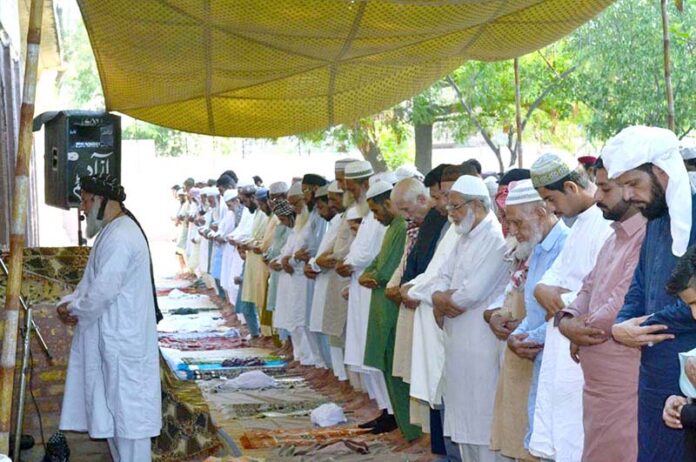 Federal Minister for Maritime Affairs Qaiser Ahmed Sheikh offering Eid prayer